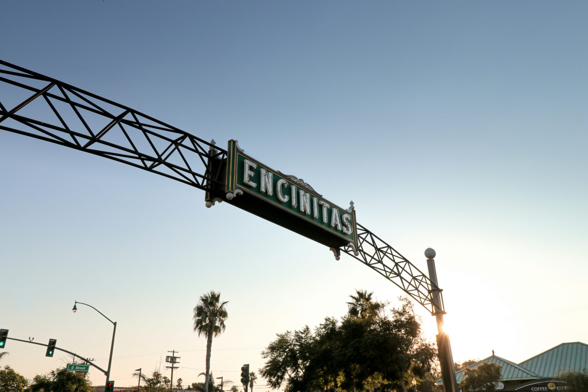 The Encinitas sign arching over Coast Highway 101 at sunset